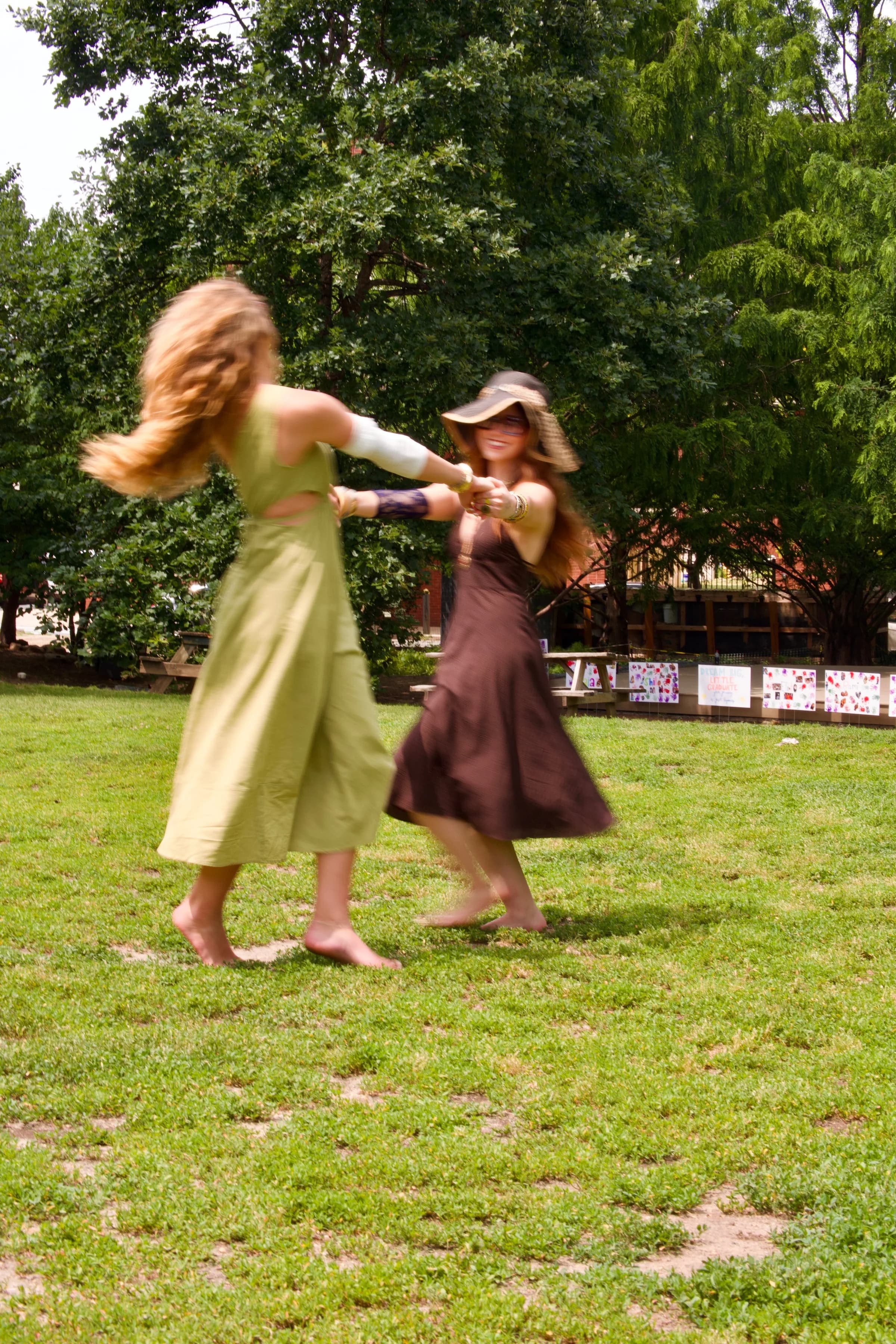 Two friends dancing outdoors wearing Nova covers