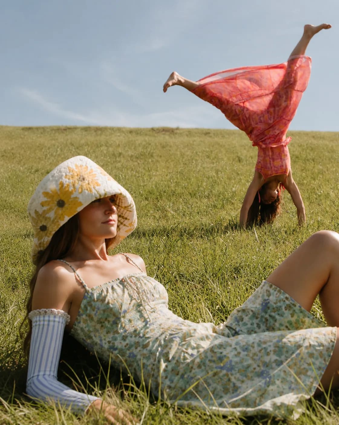 Two friends relaxing outdoors wearing midline covers